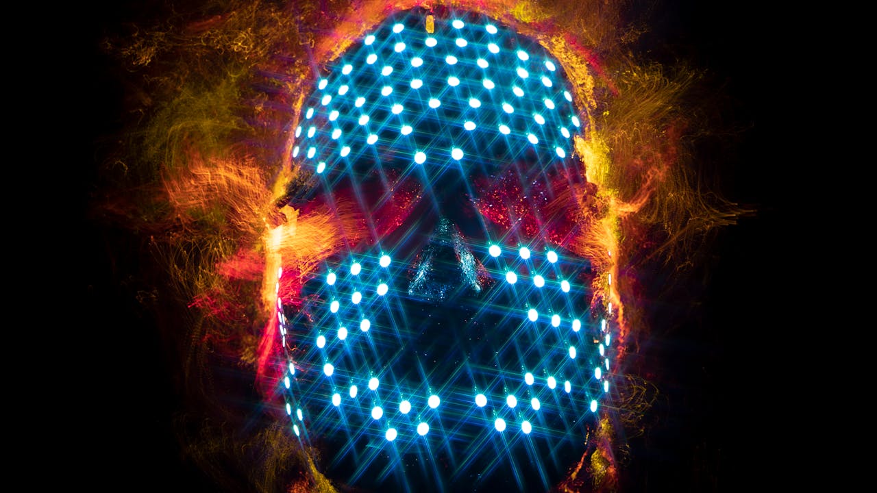 our-story Abstract image of a digital skull with glowing neon lights, representing technology and innovation.